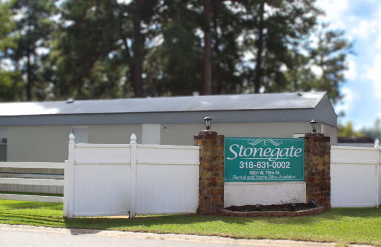 Stonegate community sign in front of manufactured home